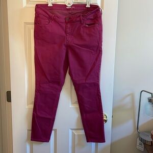 Dark Pink Rockstar Super Skinner colored jeans.